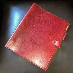 Vintage red leather folder or binder.